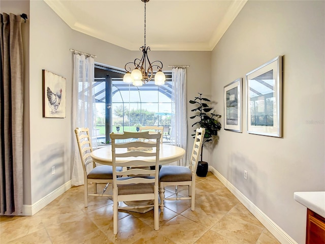 dining space featuring a chandelier and ornamental molding