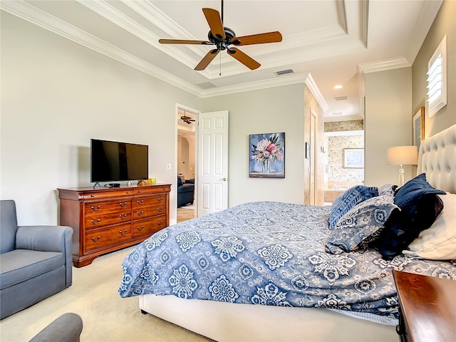 carpeted bedroom with ceiling fan, crown molding, a tray ceiling, and multiple windows