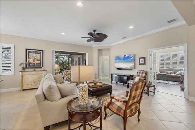 living room with ceiling fan, ornamental molding, and light tile patterned flooring