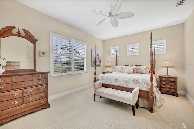 bedroom featuring ceiling fan and light carpet