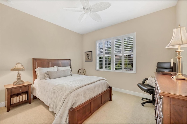 bedroom featuring light carpet and ceiling fan