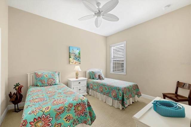 bedroom with ceiling fan and light carpet