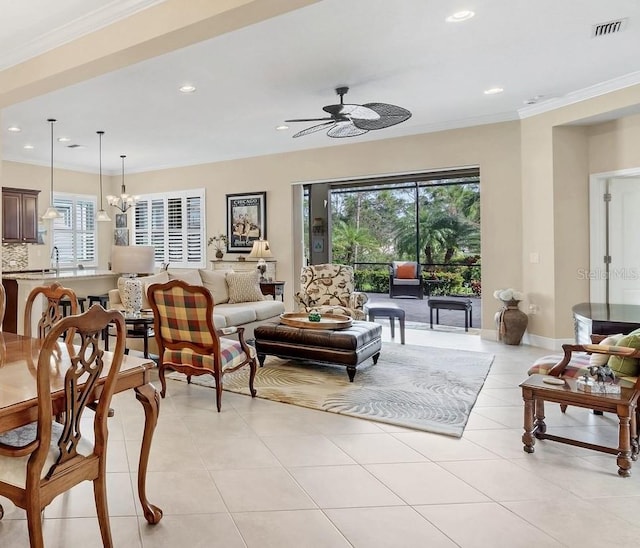 tiled living room featuring ceiling fan with notable chandelier and crown molding