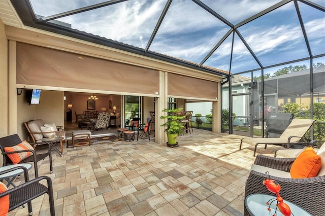 view of patio / terrace featuring outdoor lounge area and a lanai