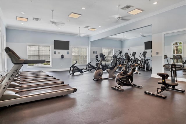 exercise room featuring ceiling fan and ornamental molding