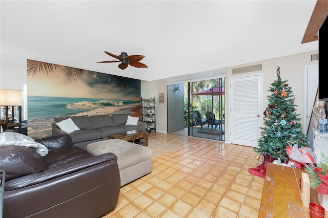 tiled living room with ceiling fan