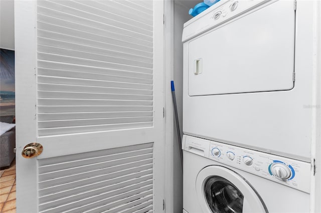 clothes washing area with stacked washer / drying machine