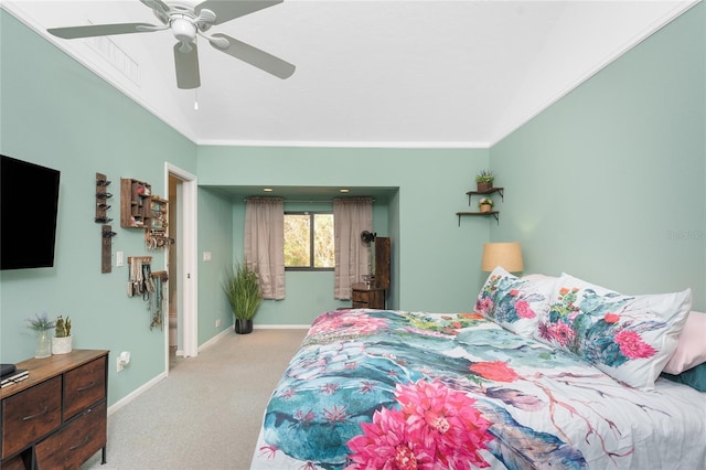 bedroom featuring ceiling fan, crown molding, and light carpet