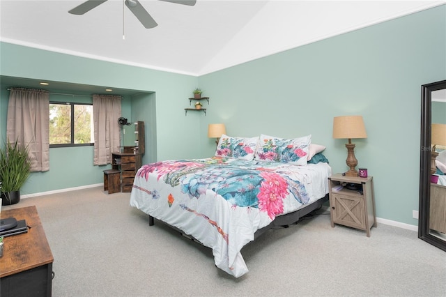 carpeted bedroom with ceiling fan and lofted ceiling