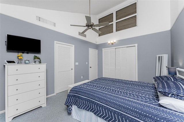 carpeted bedroom with ceiling fan and lofted ceiling