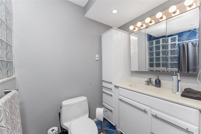 bathroom with vanity and toilet