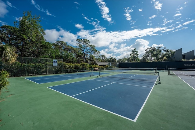 view of tennis court with basketball court