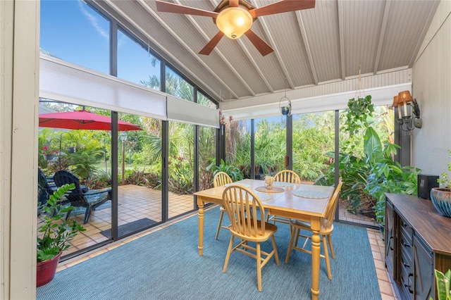 sunroom featuring lofted ceiling and ceiling fan