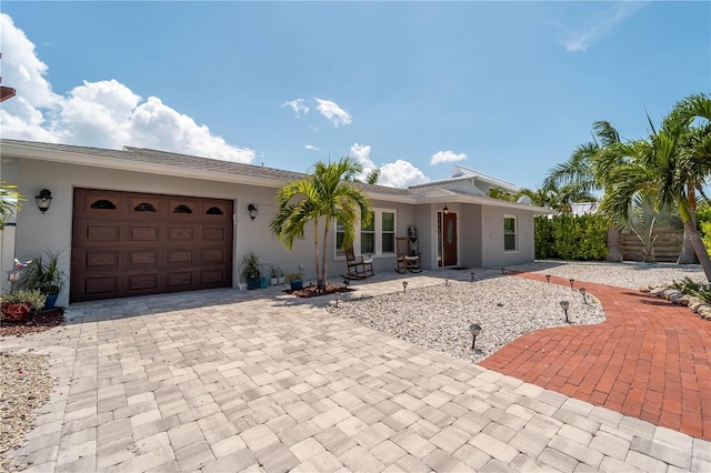 ranch-style house featuring a garage