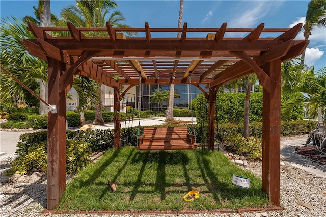 surrounding community with a yard and a pergola