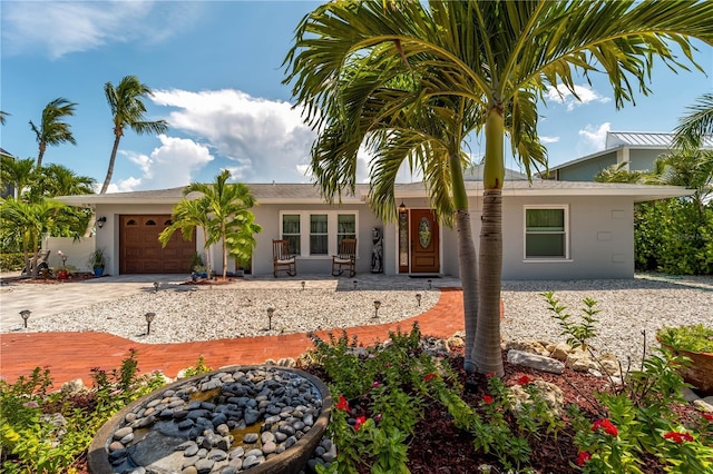 922 Casey Cove Dr, Nokomis, FL 34275 - ranch-style house with stucco siding, driveway, and an attached garage