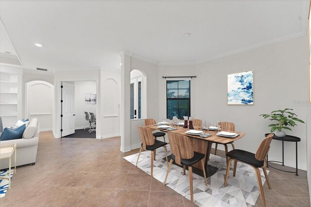 tiled dining space with crown molding