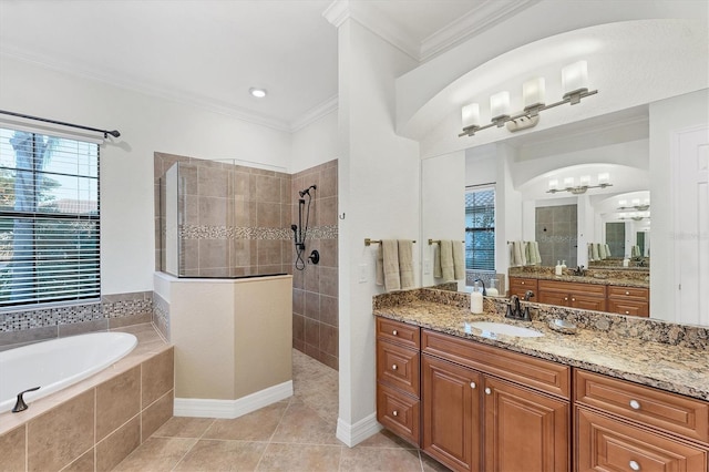 bathroom with tile patterned floors, vanity, ornamental molding, and shower with separate bathtub