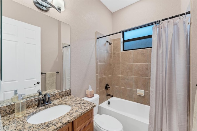 full bathroom with vanity, shower / bathtub combination with curtain, and toilet