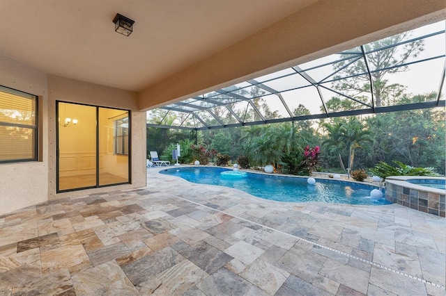 view of swimming pool with glass enclosure, pool water feature, an in ground hot tub, central AC, and a patio area