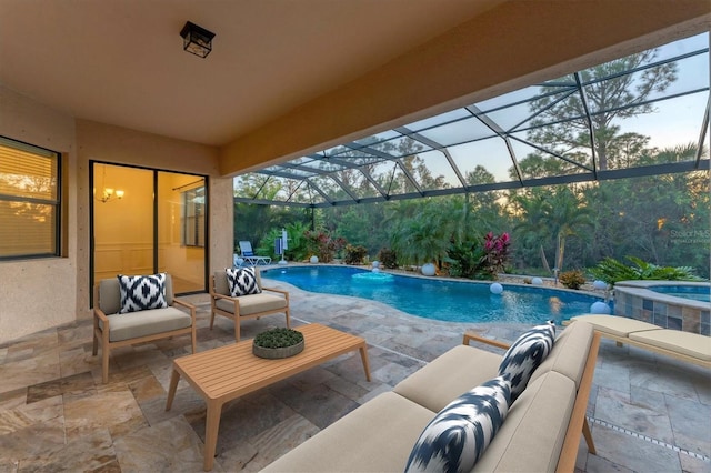 view of swimming pool with a patio, an outdoor living space, pool water feature, and glass enclosure