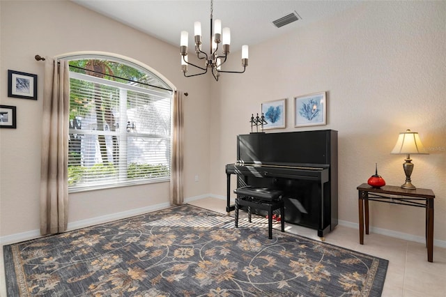 miscellaneous room with tile patterned flooring and a notable chandelier