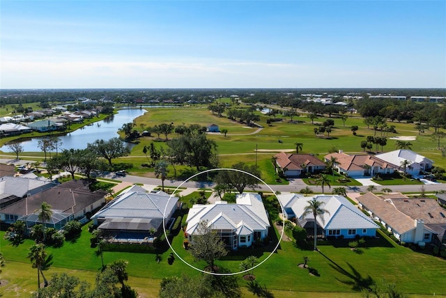 bird's eye view with a water view