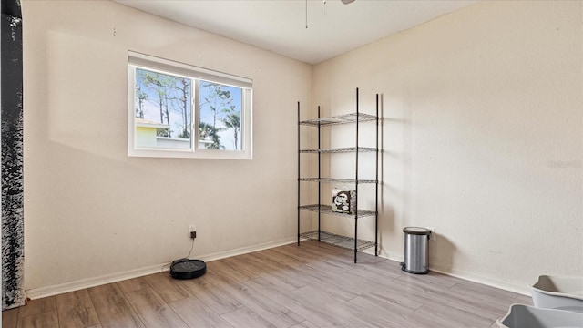 empty room with light hardwood / wood-style flooring