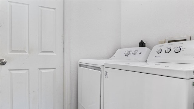 laundry room with washer and clothes dryer