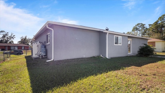 view of home's exterior with a yard