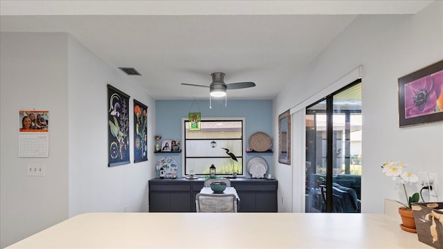 interior space featuring ceiling fan