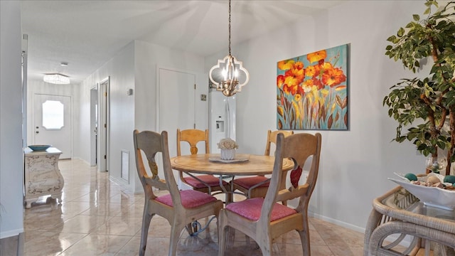 dining area featuring a chandelier