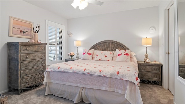 carpeted bedroom featuring ceiling fan