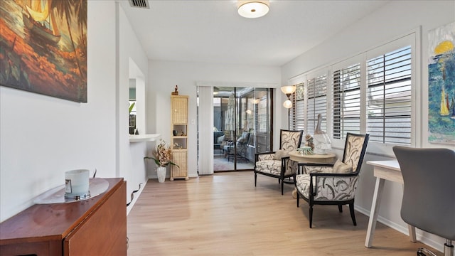 living area with light hardwood / wood-style floors