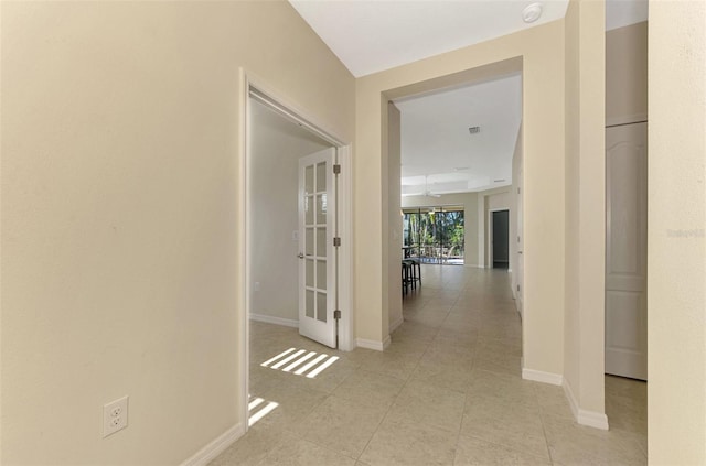 hallway featuring light tile patterned floors