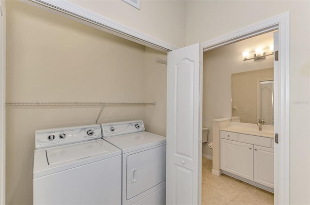 laundry room featuring separate washer and dryer and sink