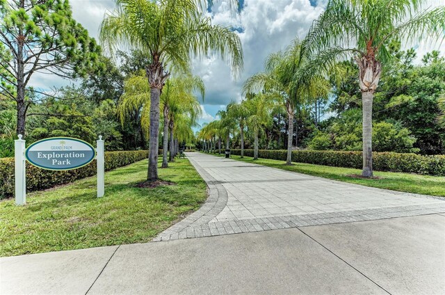 view of home's community featuring a lawn