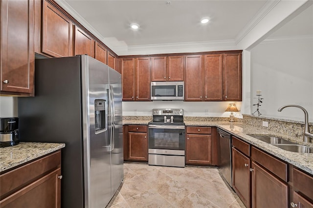 kitchen featuring light stone countertops, ornamental molding, sink, and appliances with stainless steel finishes