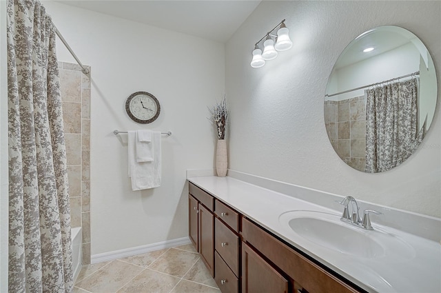 bathroom with tile patterned flooring, vanity, and shower / tub combo