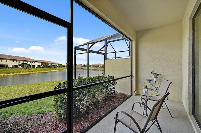 unfurnished sunroom with a water view and plenty of natural light