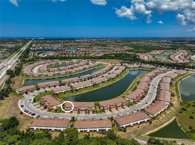 birds eye view of property featuring a water view