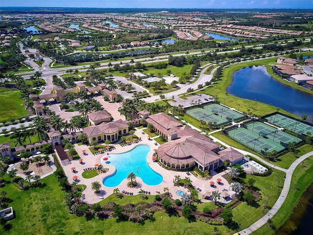 birds eye view of property with a water view