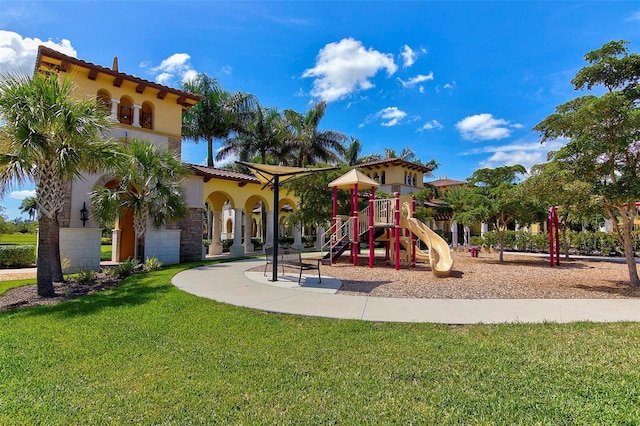 view of jungle gym featuring a lawn