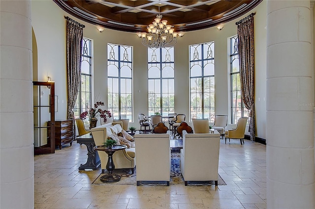 interior space with ornamental molding, coffered ceiling, beam ceiling, a chandelier, and a high ceiling