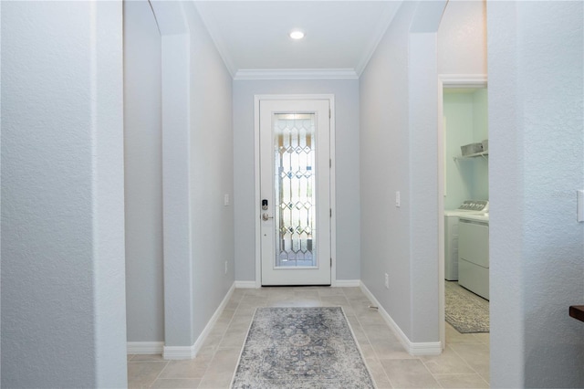 entrance foyer with independent washer and dryer and ornamental molding