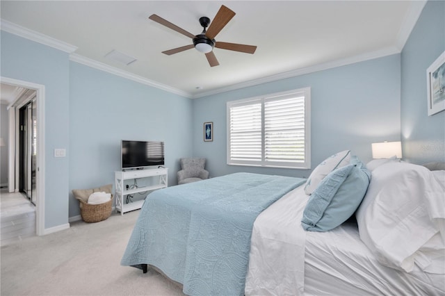 carpeted bedroom with ceiling fan and crown molding