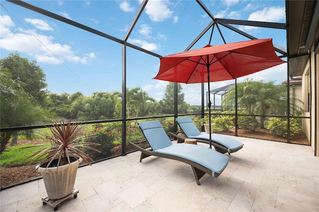 view of patio / terrace with glass enclosure