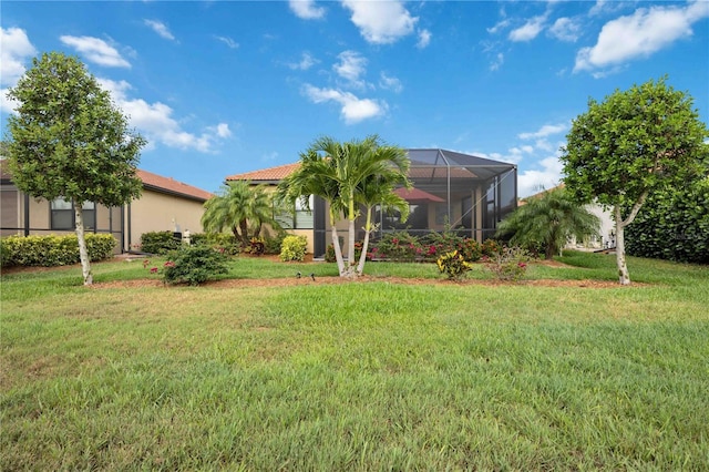 view of yard with glass enclosure