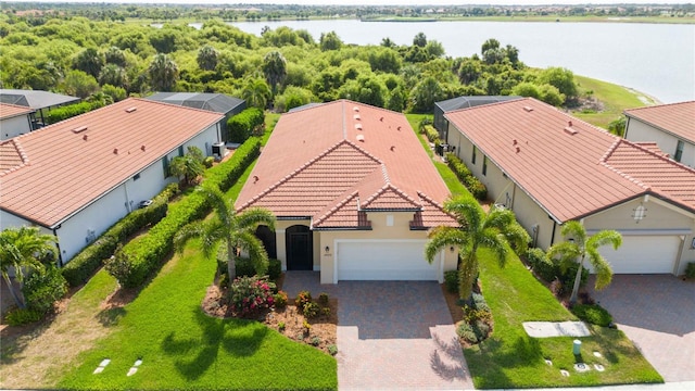 birds eye view of property with a water view