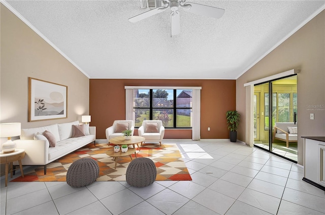 living room featuring ceiling fan, light tile patterned flooring, a textured ceiling, and vaulted ceiling